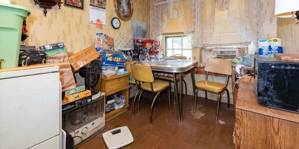 apartment with piles of junk in kitchen
